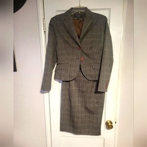 Ladies suit. Size 10. Signature by Larry Levine. Grey with orange threading